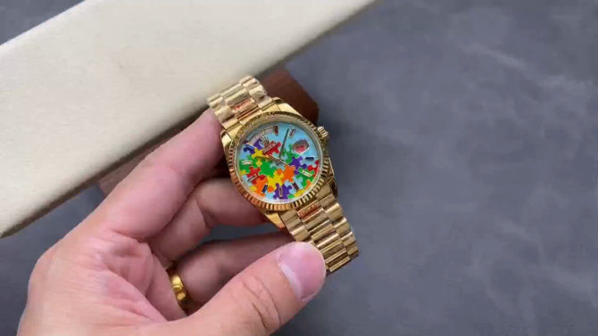 Replica Rolex Day Date 128238-0106 36mm Yellow Gold Fluted Bezel Emoji Puzzle Dial
